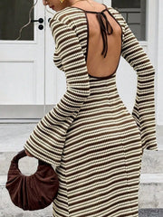 On-model back view of the brown and cream striped dress showing the open tie back