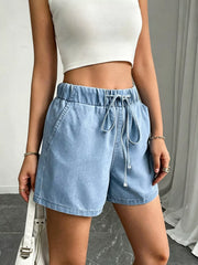Women's high-waisted denim shorts with a tied drawstring and pockets.