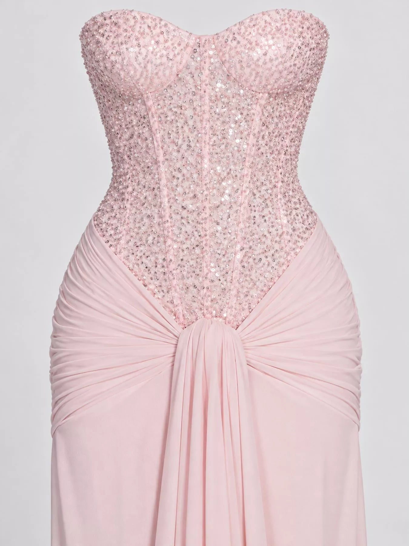 Pink strapless sequin corset bodice and knotted draped waist, close detail view