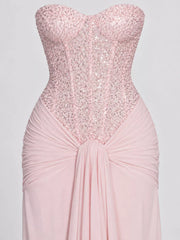 Pink strapless sequin corset bodice and knotted draped waist, close detail view