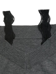 Close up of dark grey sweater black lace trim straps and ribbed neckline detail