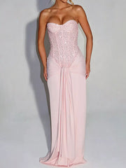 Pink strapless sequin corset maxi dress on model, full length front view in studio
