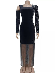 Black asymmetrical rhinestone dress on a mannequin front view with fringe hem