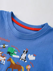 Close-up of blue crew neckline with red trim and the top of the farm alphabet print
