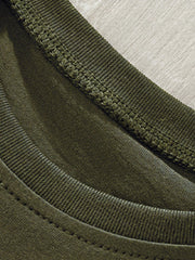 Close-up of the ribbed crew neckline and stitching on an army green children's T-shirt