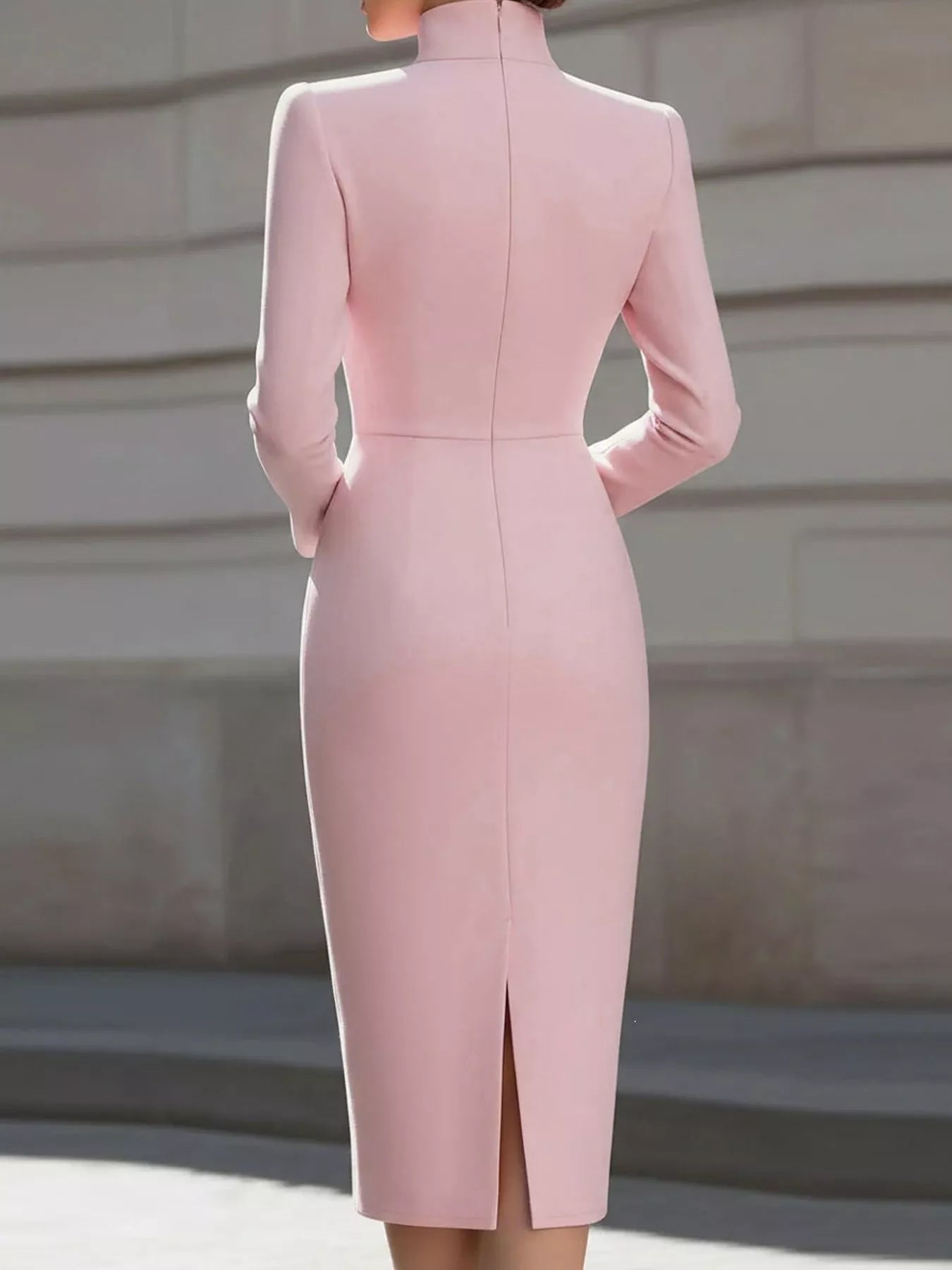 Back view of pink stand collar long sleeve midi dress with back slit outdoors