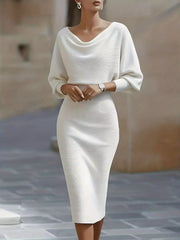 Front view of a white cowl neck bodycon midi dress with three quarter sleeves outdoors