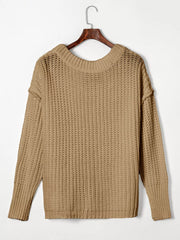 Back view of taupe ribbed knit sweater with round neckline and long sleeves on a hanger.