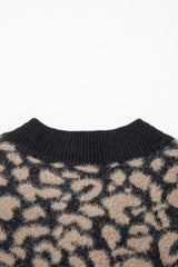 Close up of black ribbed back neckline on leopard print knit vest.