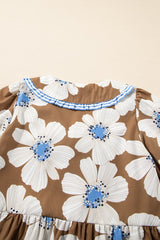 Blusa con mangas anudadas y estampado floral a rayas