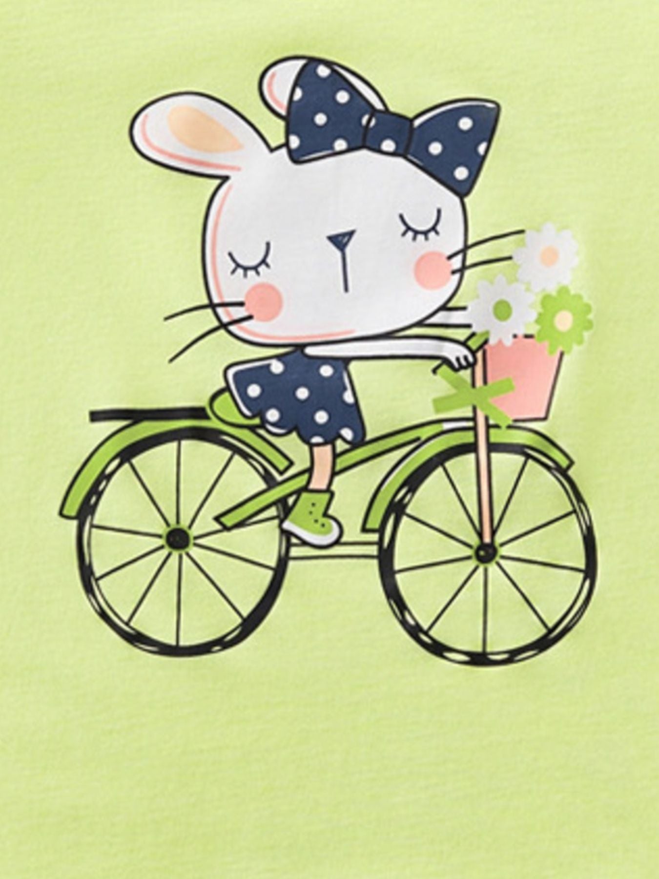 Close view of the rabbit with polka dot bow riding a bicycle on the children's t-shirt