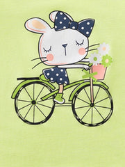 Close view of the rabbit with polka dot bow riding a bicycle on the children's t-shirt