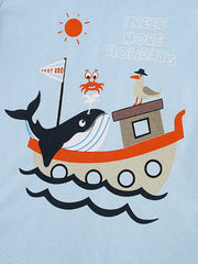 Close view of the whale boat crab and seagull graphic on the light blue children's tee