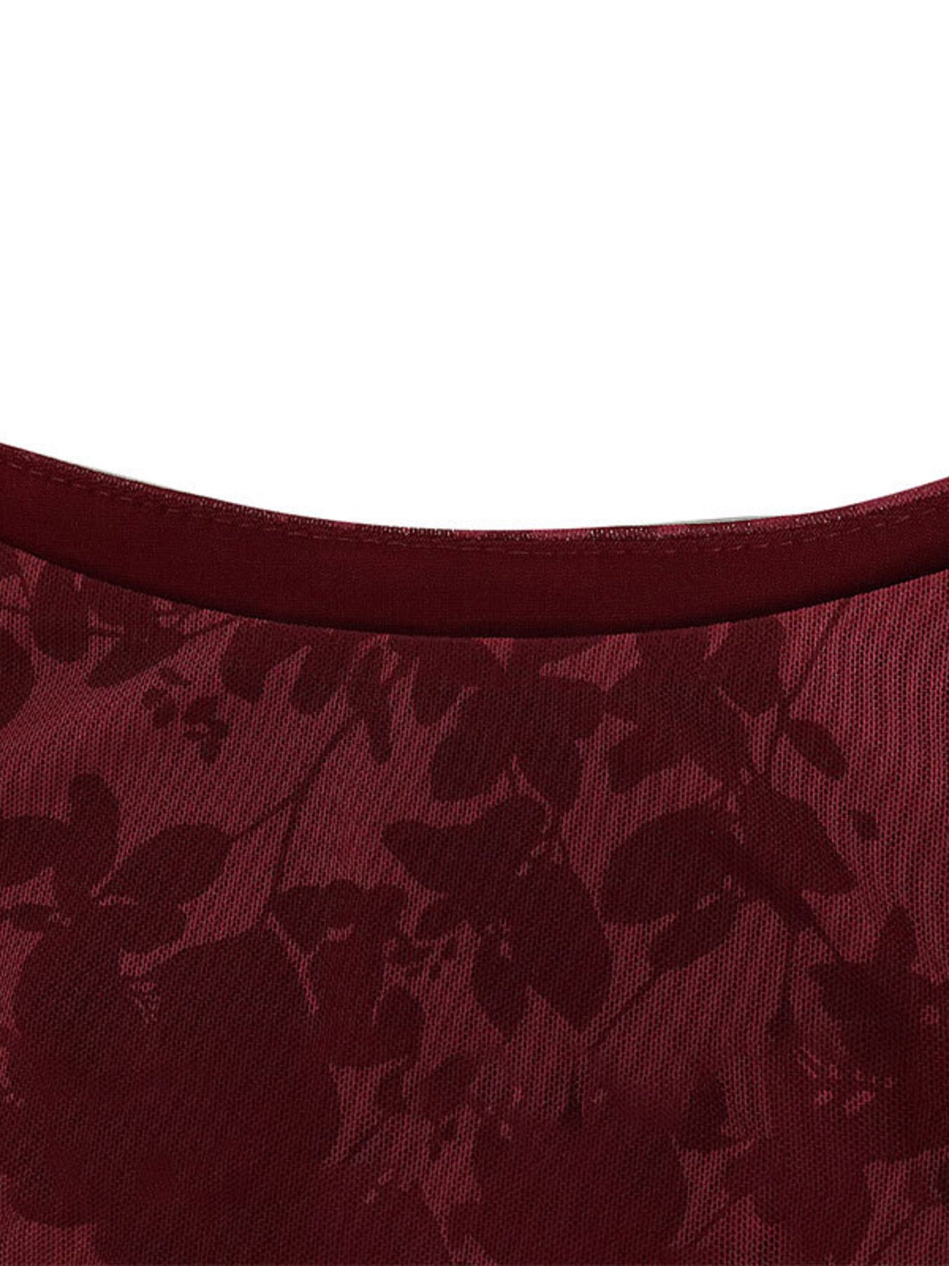 Burgundy floral mesh neckline close up showing round neck and stitching of mini dress
