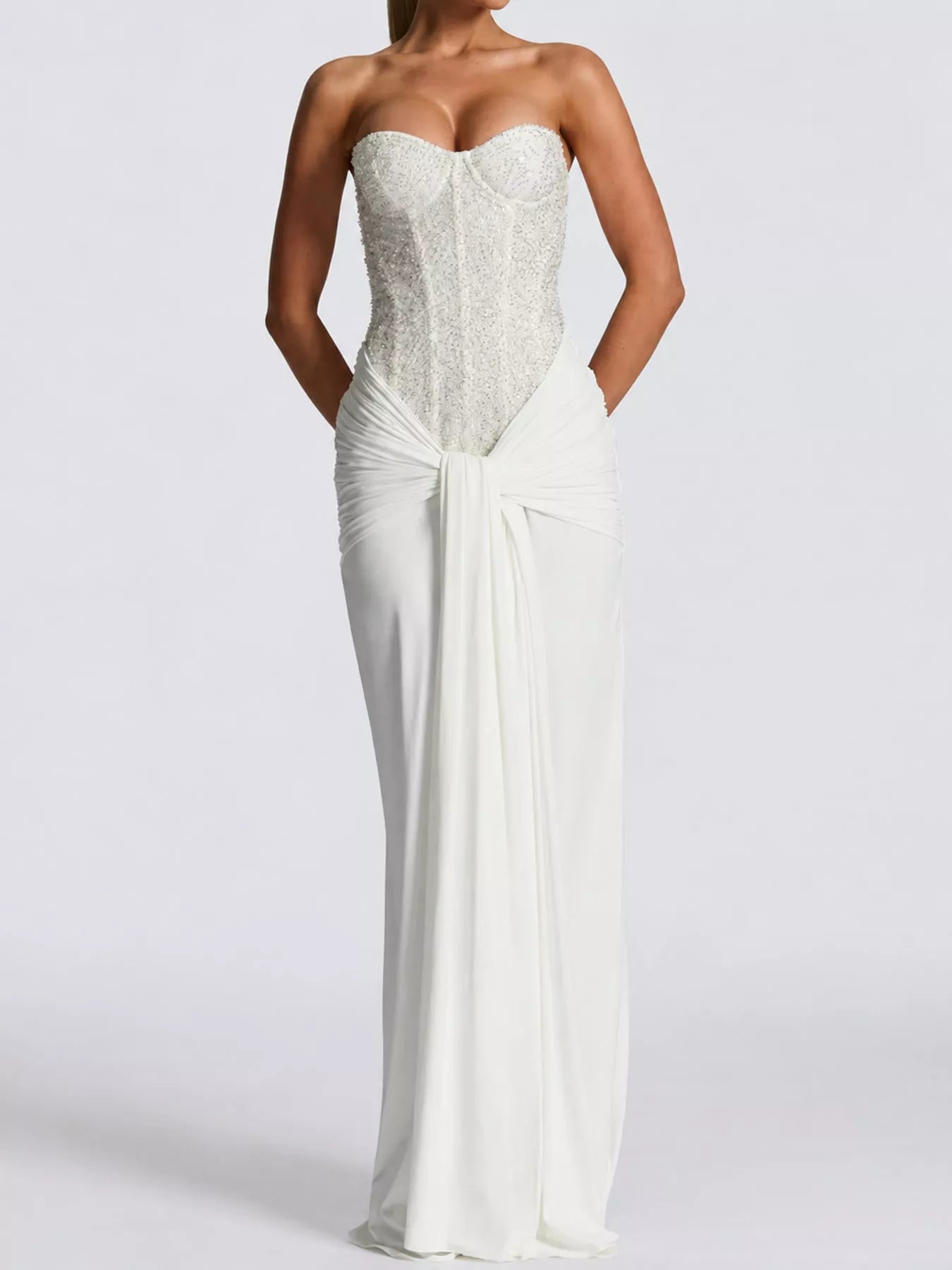 White strapless sequin corset maxi dress with draped waist on model, full length studio front view