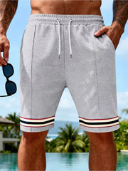 Men's gray textured knit shorts with a drawstring waist and pockets.