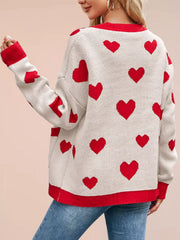 Back view of the cream knit cardigan with red hearts and red trim