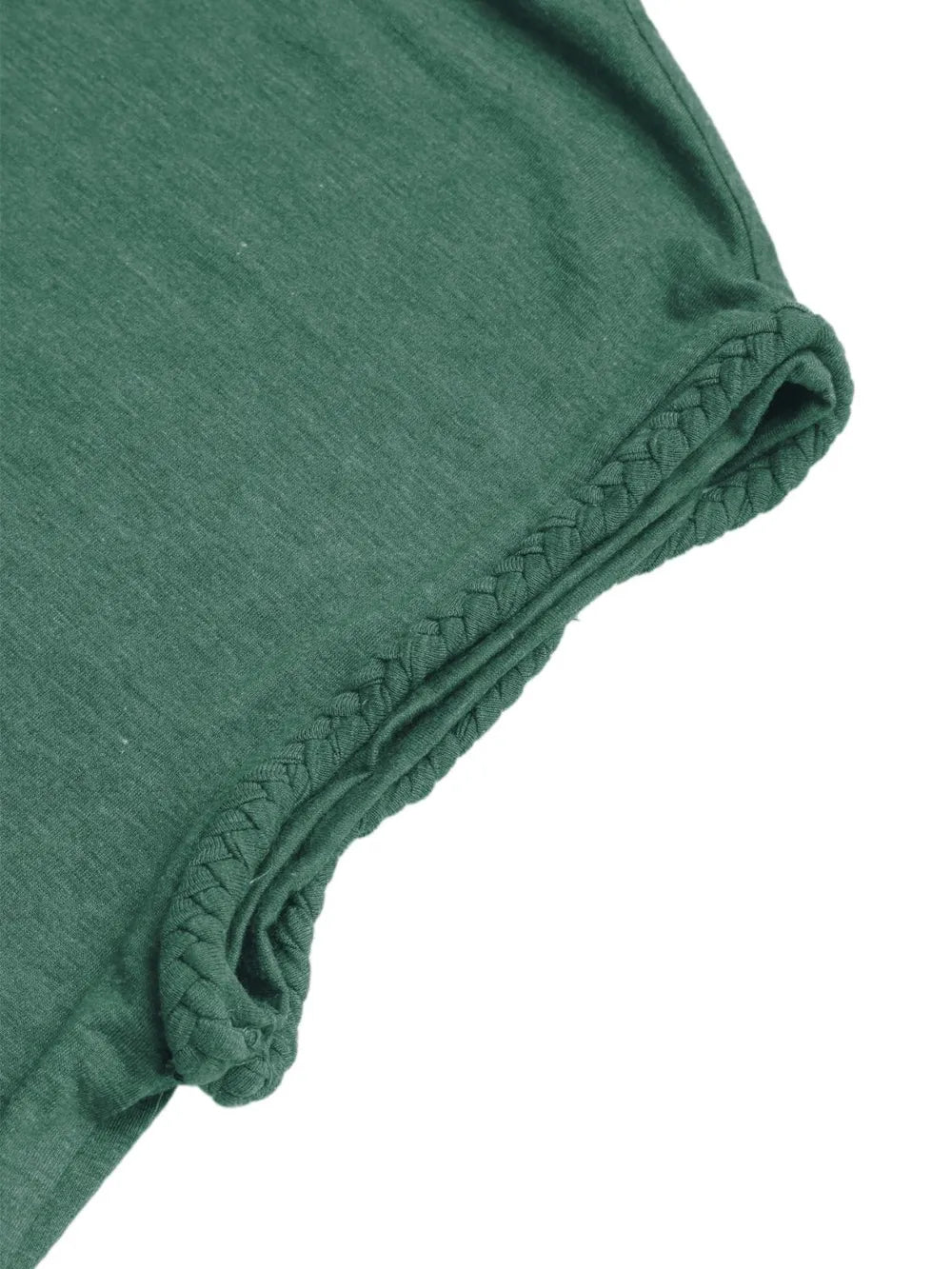 Close-up detail of the green cap sleeve T-shirt’s rolled sleeve edge and decorative stitching