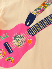 Close detail of the pink guitar body with floral sound hole heart and rainbow motifs