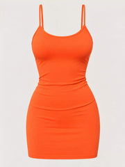 Orange scoop neck cami dress with thin straps, flat front view on plain background