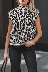 Front view of a black and cream leopard print high neck sweater with cap sleeves and black trim.
