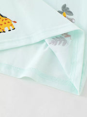 Close-up of the mint blue polo hem stitching beside an embroidered giraffe motif