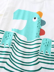 Close-up of turquoise cartoon dinosaur graphic above wavy green stripes on white t-shirt