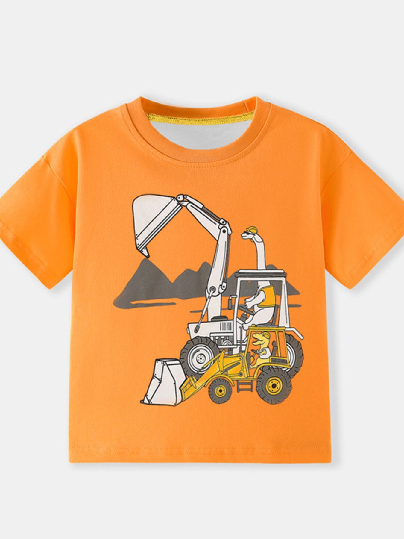 Orange children's short sleeve T-shirt with a cartoon dinosaur driving an excavator graphic, laid flat