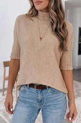 On-model front view of a beige high neck short sleeve sweater with ribbed trim