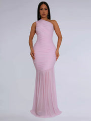 Blush pink one shoulder ruched bodycon maxi dress with flowing skirt, front view on model