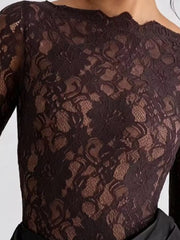 Close detail of black floral lace bodice on long sleeve maxi dress