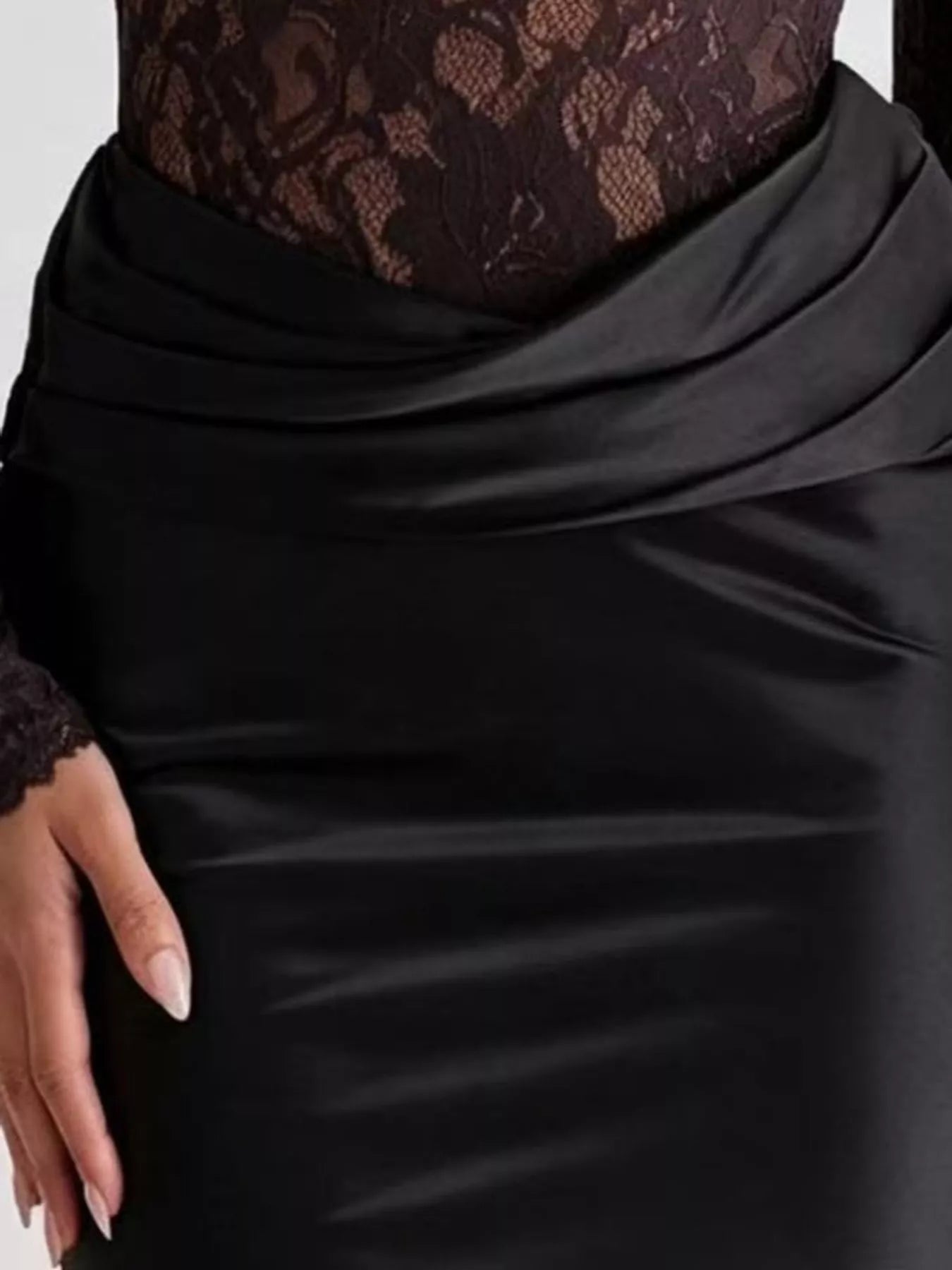 Close detail of black draped satin waist on lace bodice maxi dress