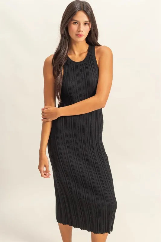 Black sleeveless ribbed knit bodycon dress with round neck, front view with arms crossed