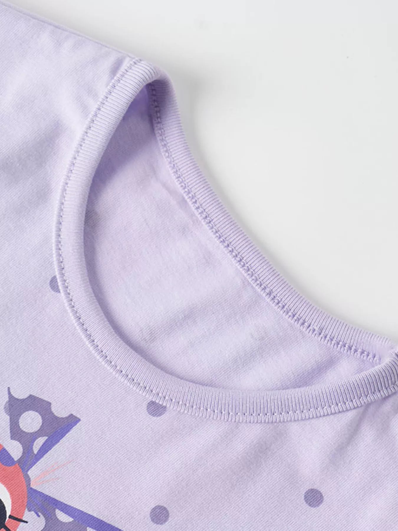 Close view of the ribbed round neckline on a lavender children's t shirt