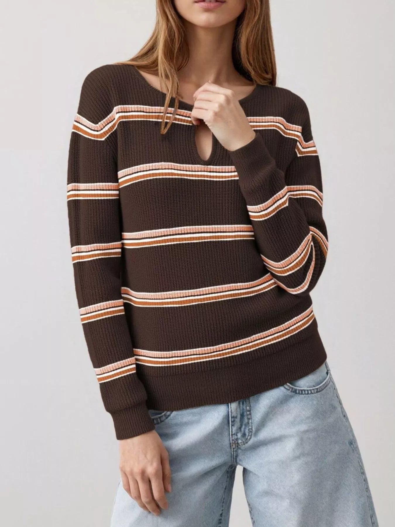 Front view of a brown striped ribbed knit top with a keyhole neckline