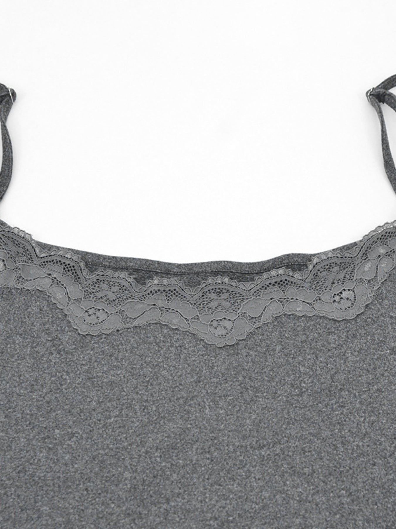 Close view of grey lace trim at the neckline of the bodycon mini dress