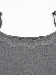 Close view of grey lace trim at the neckline of the bodycon mini dress