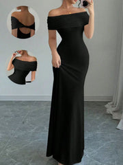 Model in full length mirror selfie wearing black off shoulder bodycon maxi dress with back detail insets
