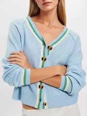 Close-up on-model front view of light blue V neck cardigan with green and cream striped trim