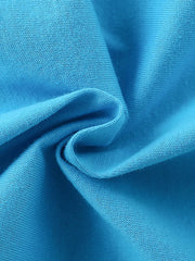 Close-up of soft sky blue cotton fabric texture with gentle folds