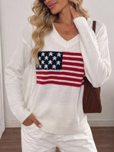 Front view of white V neck knit sweater with American flag stars and stripes print.