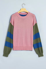 Flat lay front view of the pink sweater with green and blue striped sleeves