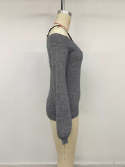 Side view of dark grey off shoulder lace trim sweater displayed on mannequin
