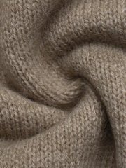 Extreme close up of khaki knit fabric showing soft textured weave