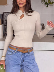 Cream ribbed knit top with mandarin collar, knot buttons and keyhole cutout, front view