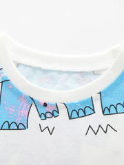 Close-up of the white round neckline and blue dinosaur print on the children's tee