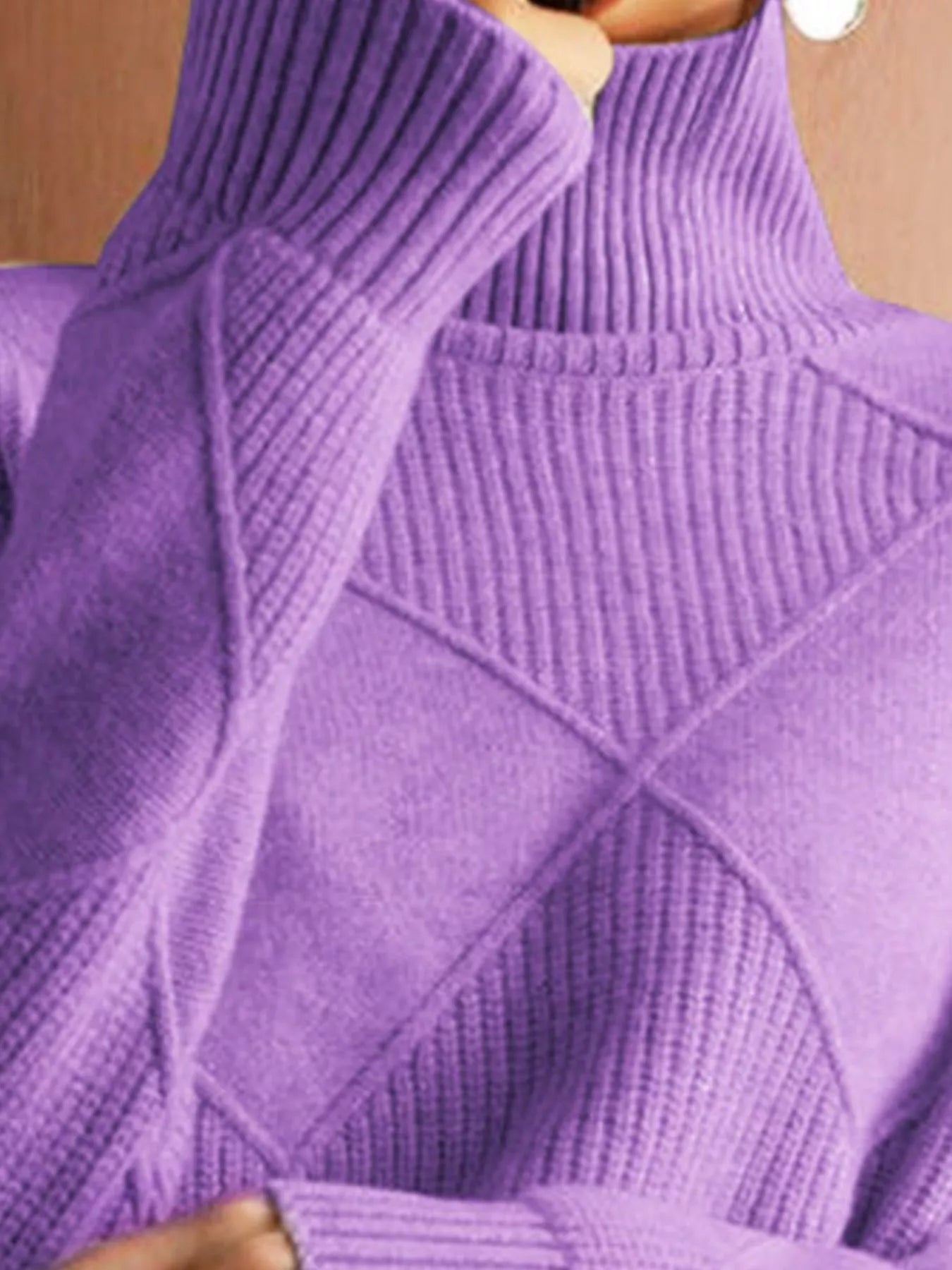 Close up of the lavender ribbed turtleneck and diamond patterned chest