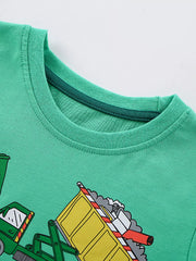 Close-up of the ribbed round neckline on the green children's T-shirt, with part of the cartoon truck print below