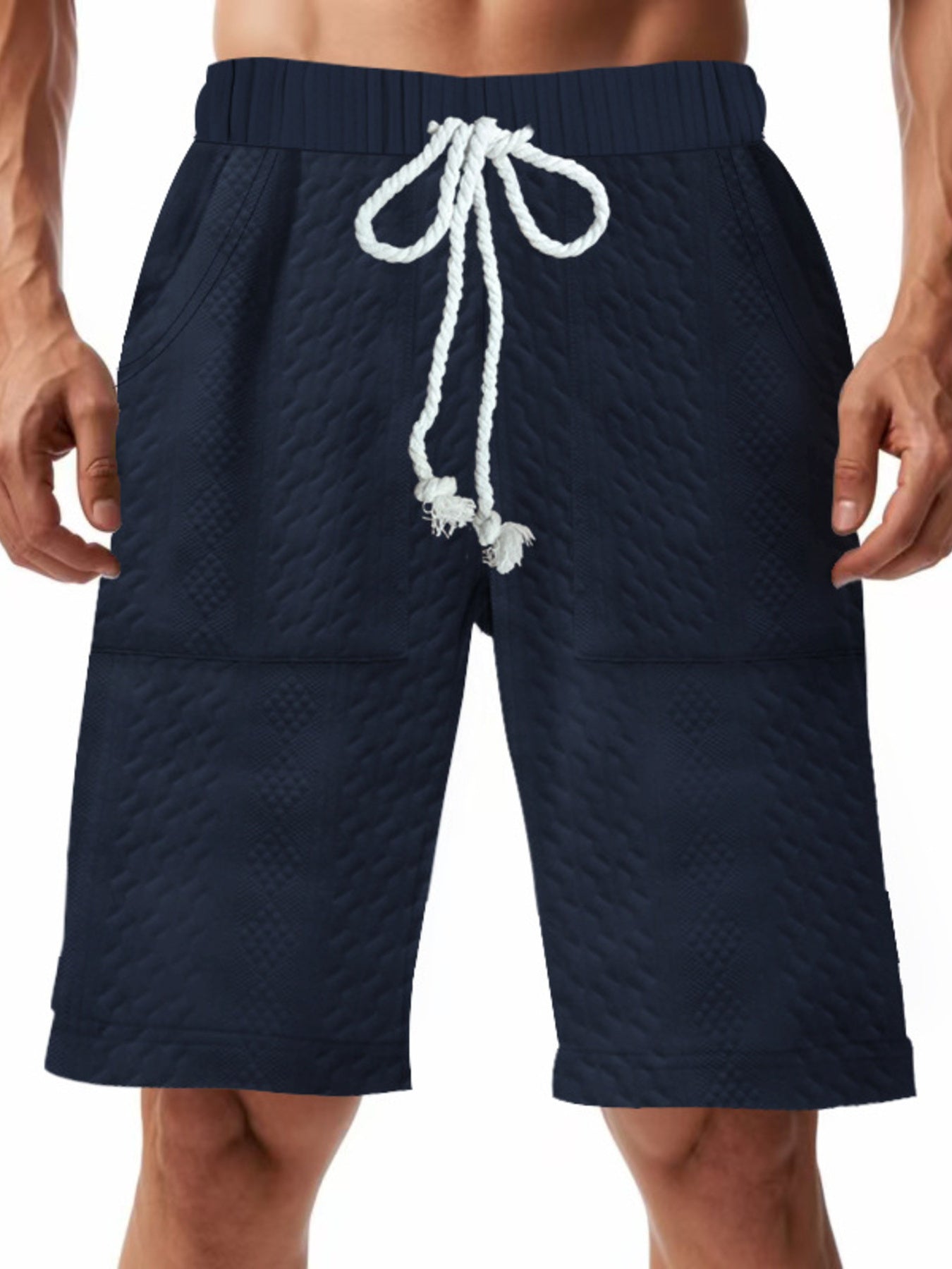 Men's navy blue textured shorts with a drawstring waist and pockets.