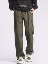 Men's green cargo pants with pockets and a relaxed fit.